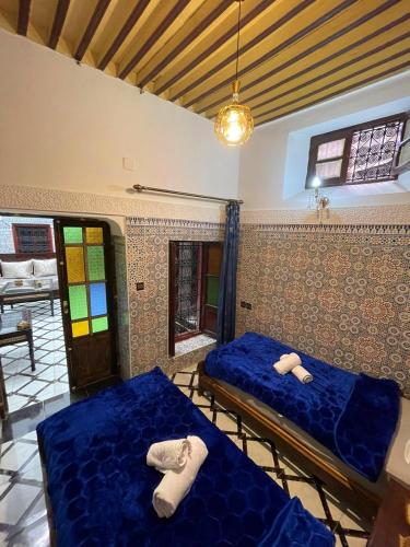 Cama o camas de una habitación en Dar Boujloud Fez