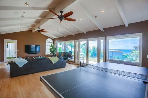 a living room with a ping pong table at GrandView in Encinitas
