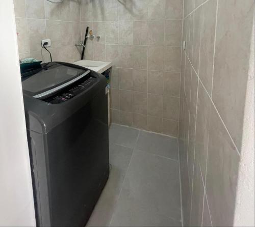 a small bathroom with a sink and a toilet at Fontana campestre in Ibagué