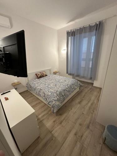 Ένα ή περισσότερα κρεβάτια σε δωμάτιο στο GiomaHoliday