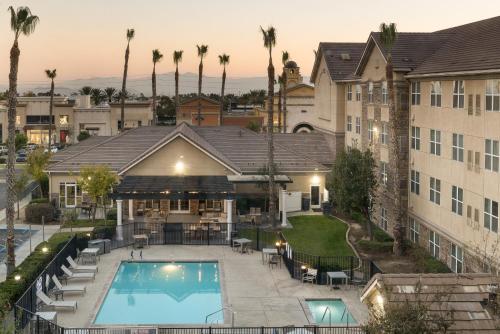an aerial view of a hotel with a swimming pool at Homewood Suites by Hilton Ontario Rancho Cucamonga in Rancho Cucamonga