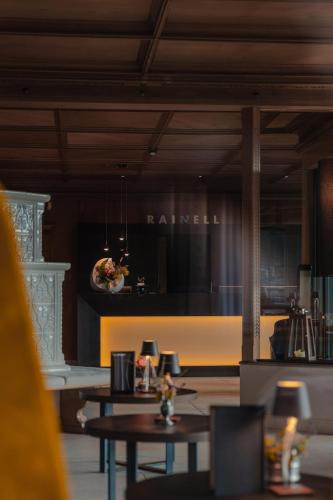 a dining room with two tables and a dining roomiasm at Rainell Dolomites Retreat in Ortisei