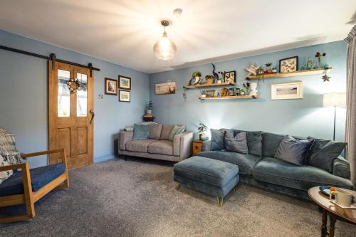 a living room with a couch and a chair at Number 19 in Ripon
