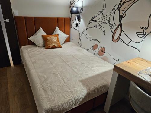 Katil atau katil-katil dalam bilik di Apartament Podskarpie