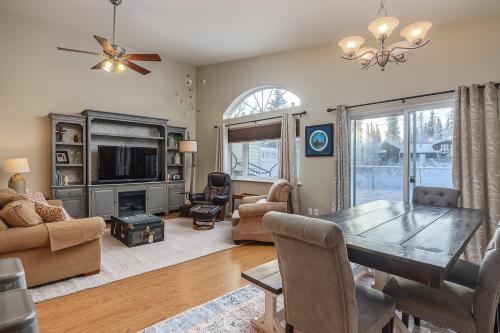 a living room with a dining table and a tv at Wondrous Willow Dog-Friendly Home in Fairbanks! in Lemeta