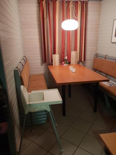 a small room with a table and a chair at Ferienhaus 52 in Kirchheim