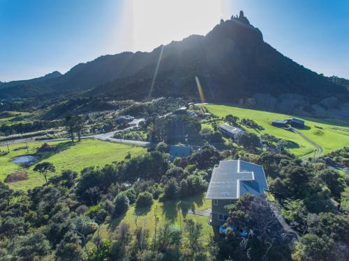 an aerial view of a house with a mountain at Views Forever in Whangarei Heads