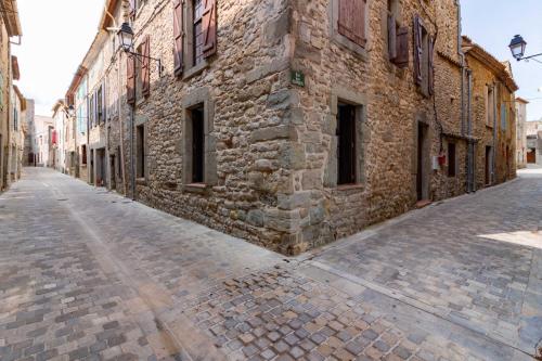 an empty street in an old stone building at Remparts House in Mailhac