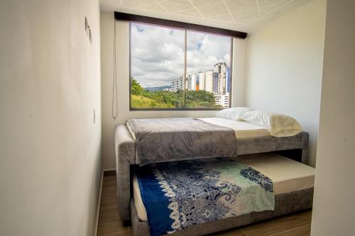 Postel nebo postele na pokoji v ubytování 1007 Nuevo Cerca Clinica Foscal & Ardila Lulle