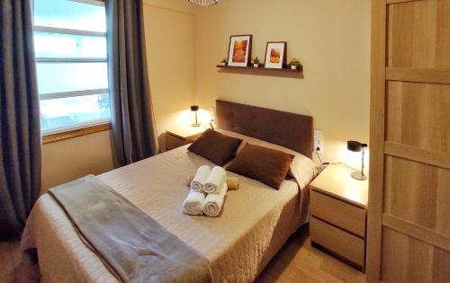 En eller flere senge i et værelse på Apartamento en Betanzos