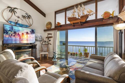 a living room with a view of the ocean at Cedar Tides in Cedar Key