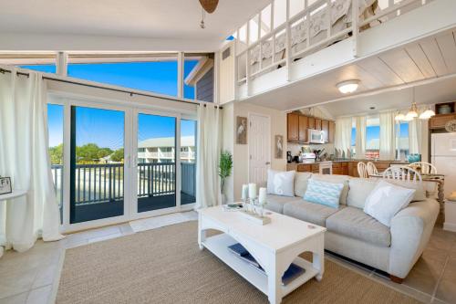 a living room with a couch and a table at Sunset Harbor 7 in Cedar Key