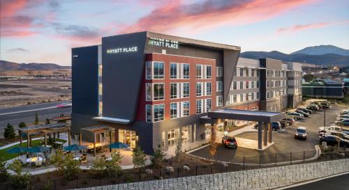 a rendering of a hotel building with a parking lot at Hyatt Place Reno in Reno