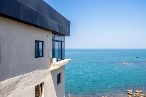 a building with a view of the ocean at Venue 360 in Freetown