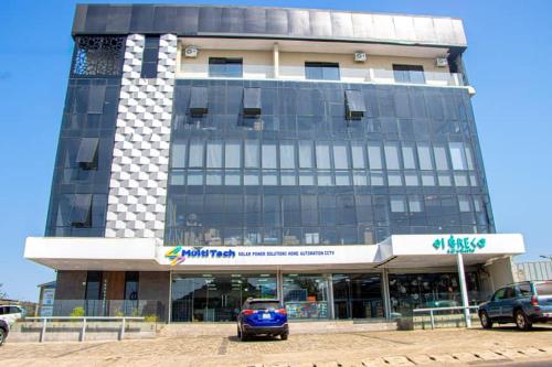 a building with a car parked in front of it at Venue 360 in Freetown