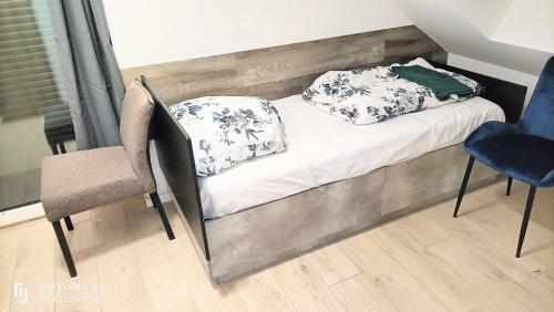 Postel nebo postele na pokoji v ubytování FMI28 Deluxe Studio-Apartments