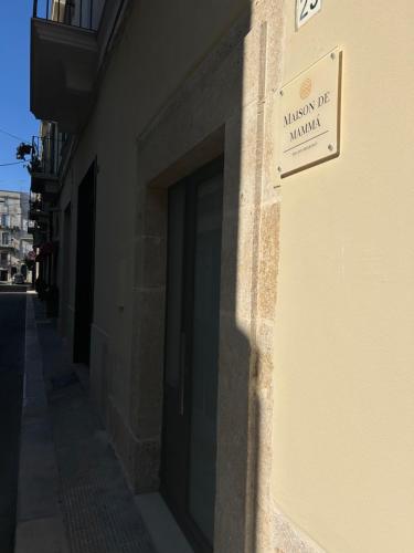 a building with a sign on the side of it at Maison De Mammà in Altamura