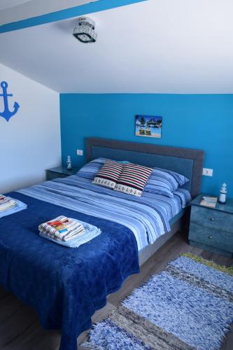 Giường trong phòng chung tại Apartmani NINA Zlatar