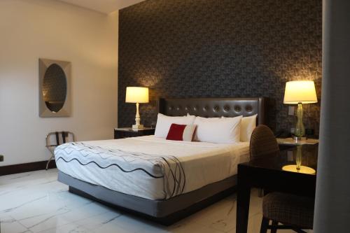 Postel nebo postele na pokoji v ubytování Hotel Wellintown