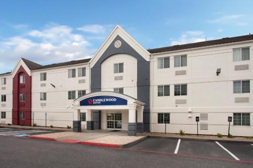 an empty parking lot in front of a building at Candlewood Suites Harrisonburg by IHG in Harrisonburg