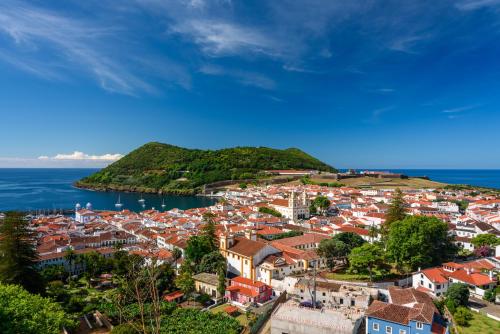 an aerial view of a town on a hill next to the ocean at Casa Terra Mar in Angra do Heroísmo