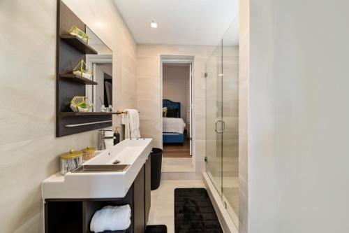 a bathroom with a sink and a shower at Miami Gucci Home with Pool & Great Location in Miami