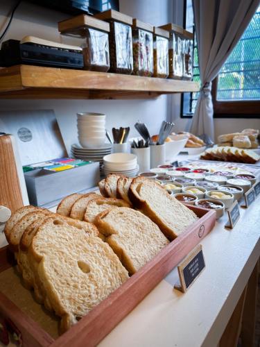 a bakery with bread and pastries on a counter at Hotel Alta Mendoza in Mendoza