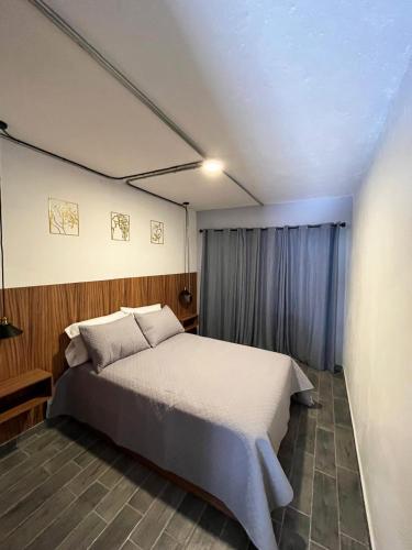 a bedroom with a large bed in a room at Eonia in Atlixco