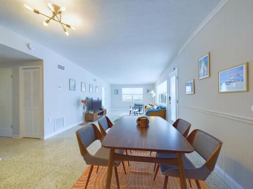 a dining room with a table and chairs at The Seaside Launch Pad in Cape Canaveral - NEW! in Cape Canaveral
