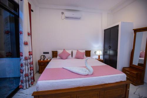 Cama o camas de una habitación en Sri Villa