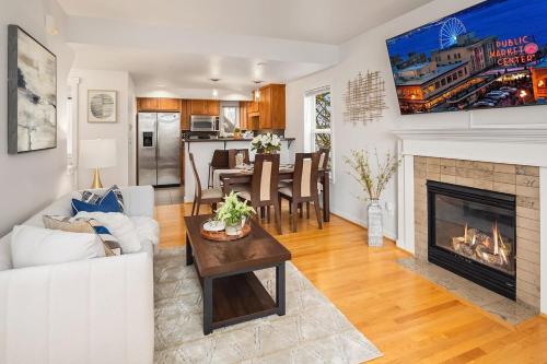 a living room with a couch and a fireplace at Cheerful Capitol Hill Home AC and 98 Walk Score in Seattle