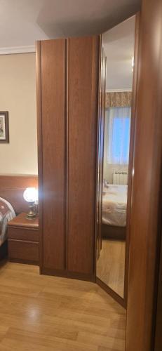 a room with a door to a bedroom with a bed at Apartamento Céntrico UNQUERA Grupo RH - 16 in Unquera