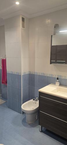 a bathroom with a sink and a toilet at Apartamento Céntrico UNQUERA Grupo RH - 16 in Unquera