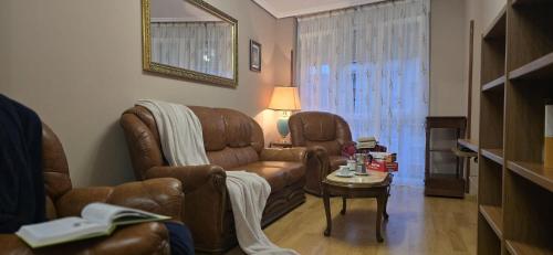 a living room with a couch and a table at Apartamento Céntrico UNQUERA Grupo RH - 16 in Unquera