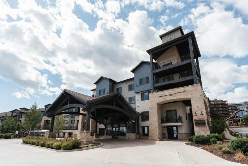 an apartment building with a large building at Newly Renovated Studio at Silverado, Ski, Relax, Enjoy World Class Amenities! in Park City