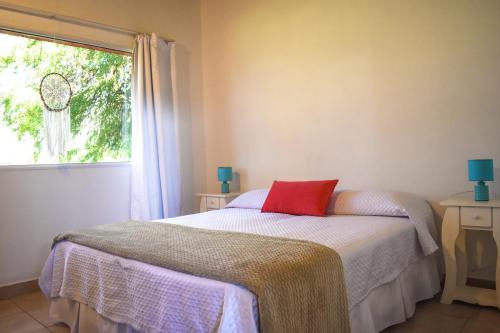 En eller flere senge i et værelse på Apart Punto Norte