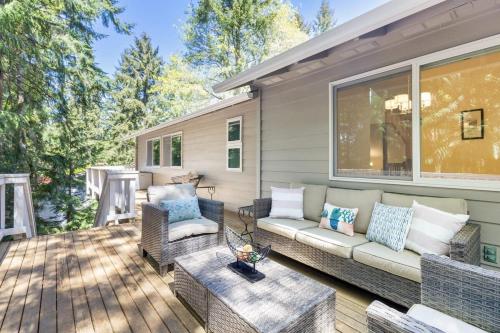 a patio with a couch and chairs on a deck at Multi functional Family Home in Redmond and only four mins to MSFT in Redmond