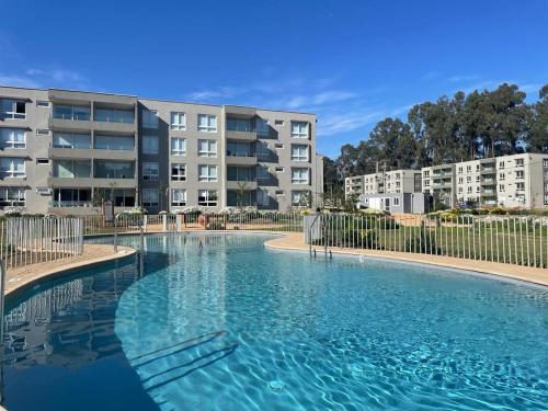 Πισίνα στο ή κοντά στο Acogedor Departamento en Papudo