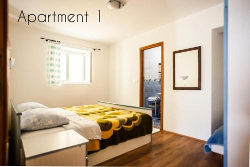 Posteľ alebo postele v izbe v ubytovaní Apartment Lopar 14804a