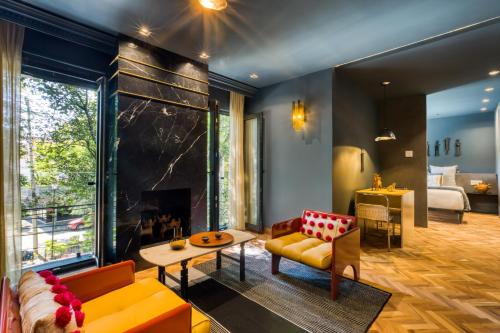 a living room with a couch and a fireplace at El Alfonsa in Mexico City