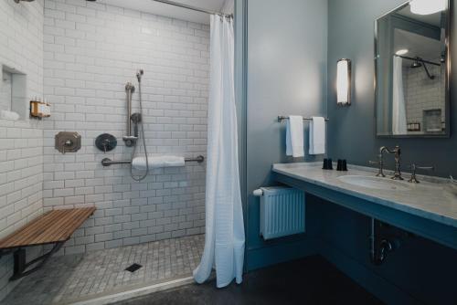 a bathroom with a sink and a shower at Surf Hotel & Chateau in Buena Vista