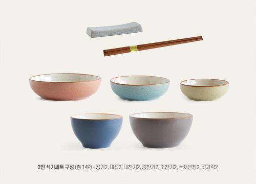 a group of bowls and chopsticks on a white background at Yeoksam Artnouveau City Hotel and Residence in Seoul