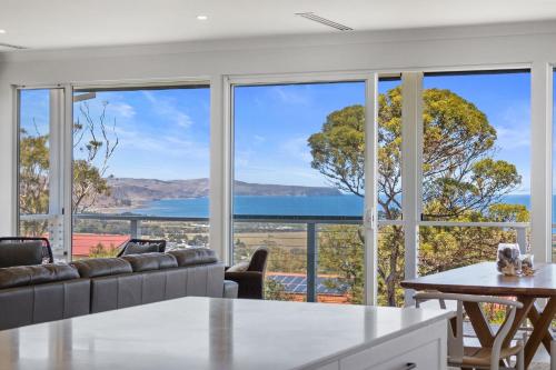 a living room with a view of the ocean at Norman Views - 20 Panorama Crescent in Normanville