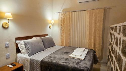Ein Bett oder Betten in einem Zimmer der Unterkunft Sunset Suite