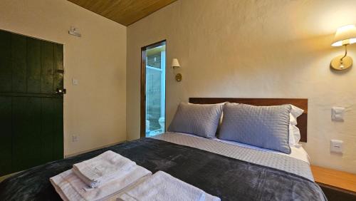 Ein Bett oder Betten in einem Zimmer der Unterkunft Sunset Suite