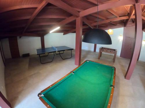 an overhead view of a pool table in a room at Delta Maresias Club by Smart Sharing in Maresias