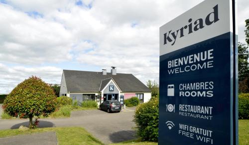 a sign in front of a house at Kyriad Rouen Sud - Oissel in Saint-Étienne-du-Rouvray