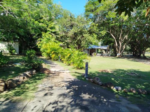 a garden with trees and a dirt road at Bella Luxury Suite in Coronado in Playa Coronado