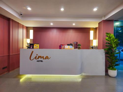 a limina logo on a counter in a lobby at Lima Hotel in Phra Nakhon Si Ayutthaya