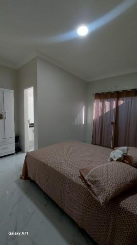 Ένα ή περισσότερα κρεβάτια σε δωμάτιο στο Paracuru casa temporada Villa Ariane